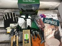 Full view of all items in the garden set including gloves, tote bag, gardening tools, Plant Nanny, and PopVase