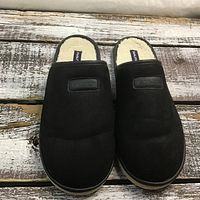 Top view of the black Nautica slippers showing the upper part with the brand patch and the fleece lining inside.
