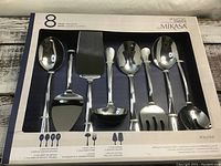 Full view of the Mikasa 8-piece serving set in box showing all items included.