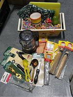 Full lot including mini food processor, utensils, skewers, brushes, ceramic cup in wooden crate with shredded paper filler.