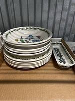 Stacked view of salad plates and small rectangular dish showing thickness and rim design