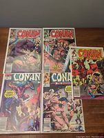 Five Conan the Barbarian comics shown front covers, bagged and boarded. Issues numbered 179, 222, 224, 225, 226 visible.