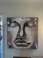 Front view of large 40x40 inch square Buddha painting showing facial features and silver leaf highlights.