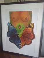 Framed fine art print showing the full artwork of torso with butterflies and rose in vibrant colors.