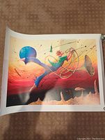 Full view of colorful surreal seriolithograph art print with whimsical figure on textured paper.