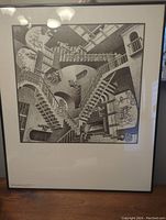 Full view of framed print showing the entirety of M.C. Escher's 'Relativity' artwork, including the black frame and white mat.