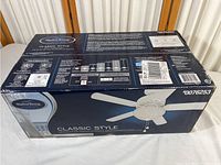 Box of Harbor Breeze ceiling fan showing model number 007-6253 and classic style with white finish