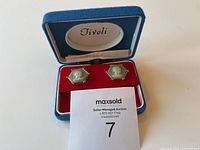 Pair of cameo cufflinks in original Tivoli blue box with red velvet interior.