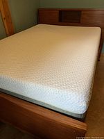 Overview of assembled bed frame with mattress and box spring