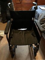 Full frontal view of the wheelchair seating area and armrests