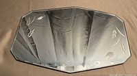 Top view of rectangular etched glass tray showing decorative leaf pattern and beveled edges.