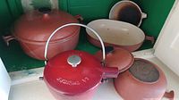 All cookware pieces together including Dutch oven, kettle, casserole, and skillet