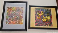 Two framed abstract doodle artworks by Paco Engel, side by side, showing detailed colorful patterns and black frames.