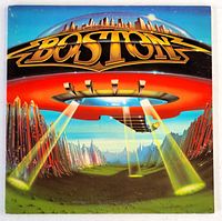 Front cover of Boston's 1978 album "Don't Look Back" showing spaceship and city skyline artwork.