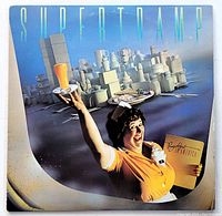 Front cover of Supertramp's 1979 album "Breakfast in America", featuring waitress illustration and band name.