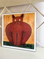 Full view of one red cat wall plaque showing full artwork and border