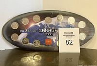 2000 Canadian Millennium coin set with 13 coins on a dark blue background featuring space imagery and 'Millennium Canada 2000' text.