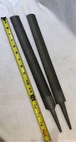 Two metal files showing entire length next to measuring tape indicating approximately 11 inches in length. Files have pointed tapered ends and textured filing surfaces.