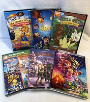 Photo showing all six DVDs in sealed cases with visible cover art