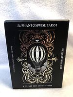 Front of the new sealed Phantomwise Tarot box showing ornate design and hot air balloon illustration