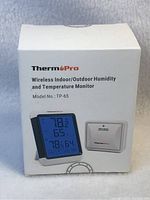 Box front showing ThermoPro branding, product name, model number TP-65, and image of device and sensor.