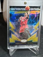 Front of Demar DeRozan basketball card in protective case showing card design, player image, and serial number 07/10.