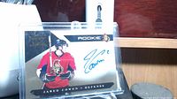 Front of Jared Cowen rookie card showing autograph, position, and Ottawa Senators logo.