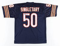Back view of navy blue Chicago Bears jersey with "SINGLETARY" and number 50 sewn on in white with orange trim.