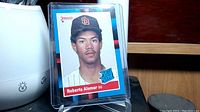 Front side of Roberto Alomar rookie card showing player image and card details like team, position, and rookie logo.