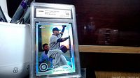 Front view of Robinson Cano 2011 Topps Chrome rookie refractor baseball card graded 10 by GMA displaying player batting image, card details, and refractor finish.