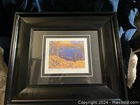 Front view of the professionally framed Tom Thomson Spring Ice print showing the entire frame and artwork.