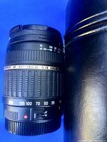 Canon 28-105mm zoom lens showing AF/M focus toggle and lens branding