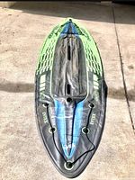 Top-down view of the kayak showing the seat, branding, and condition.