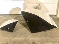 Two octagonal soft light boxes of different sizes placed on the floor showing their lengthwise profile and shape.