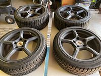 Four assembled wheels laid out on table showing overall set.