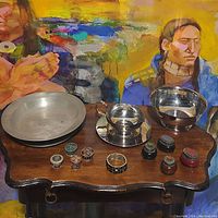 Overview of lot showing various decorative metal bowls and small containers arranged on a wooden table with colorful background painting.