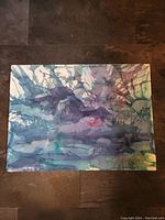 Top-down view of the original abstract untitled acrylic painting by Don Chase showing fluid blue, purple, and green tones with abstract lines.