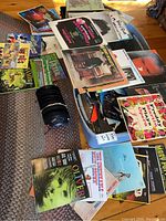 Tote on floor with loose LPs and stack of 45 rpm singles