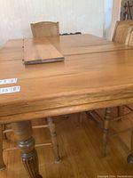 Top view showing two installed leaves and one loose leaf stacked on table