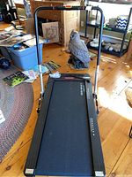 Full view of the Vibra Fit Mini Walk 3 treadmill showing treadmill surface, folding handlebar and surrounding room.