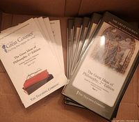 Five CD box sets and accompanying booklets laid out inside a box. Each box labeled as Part 1 through Part 5 for The Great Ideas of Philosophy 2nd Edition by The Great Courses.
