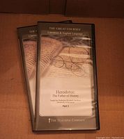 Two DVD cases entitled 'Herodotus: The Father of History' from The Great Courses series, showing the lecture title and teacher.
