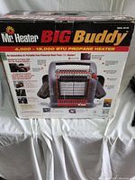 Box front displaying Mr Heater Big Buddy branding and product features including 4000-18000 BTU output.