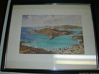 Full view of the framed watercolour painting showing coastal scene of Antigua with boats and hills.