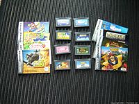 Photo showing 8 Gameboy Advance games with their original cases laid out on a surface. Cases are identifiable by the game cover artwork matching the seller's list, and cartridges are also visible.