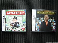 Two Nintendo DS game cases displayed side by side including Monopoly and Deal or No Deal.