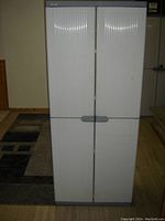 Front view of closed Keter resin plastic storage cabinet
