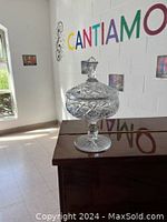 Clear crystal footed dish with intricate geometric patterns and lid with knob