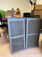 Full frontal view of gray metal Ikea cabinet with two mesh panel doors, showing diamond shaped mesh pattern and handles.