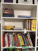Books on shelves including philosophy, language instruction books, and children's non-fiction books